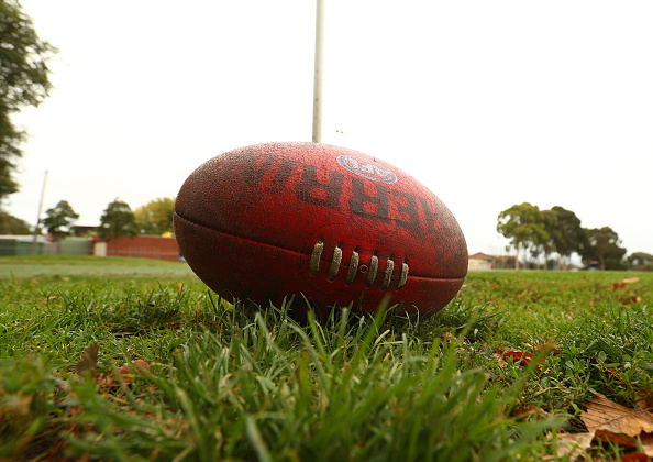 community sport an AFL football on the ground at a community sports oval.