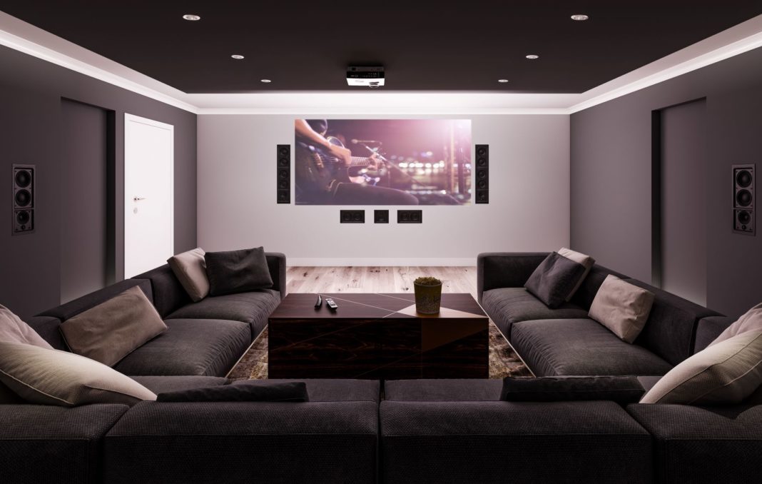 Comfortable and stylish hi-tech media room with big screen TV