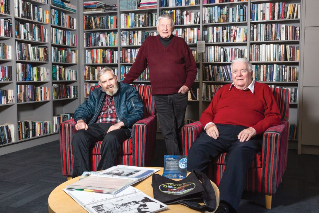 three old men in a bookshop