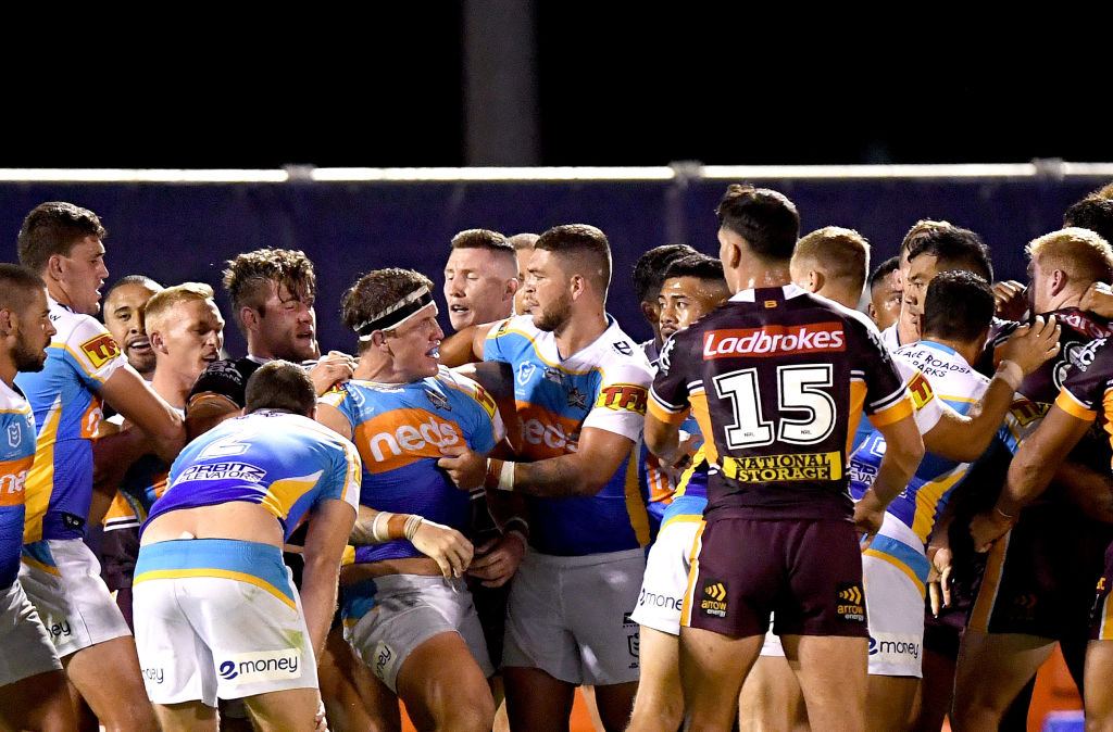 titans and broncos players in a scuffle