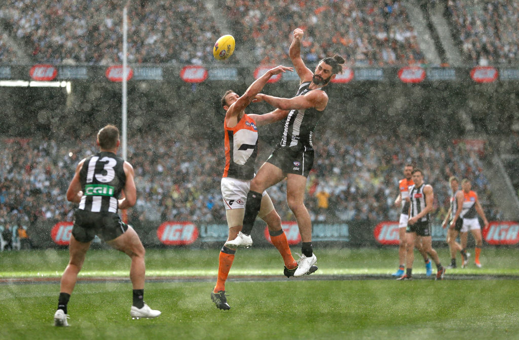 afl players playing in the rain