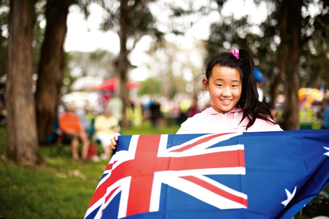 young girl holding Australian flag