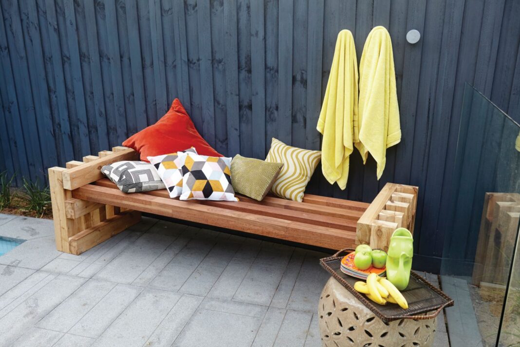 wooden daybed with pillows