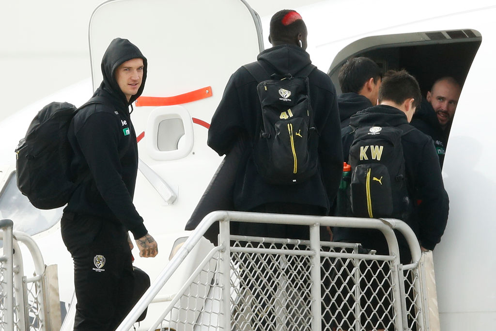 Richmond Tigers players boarding a plane