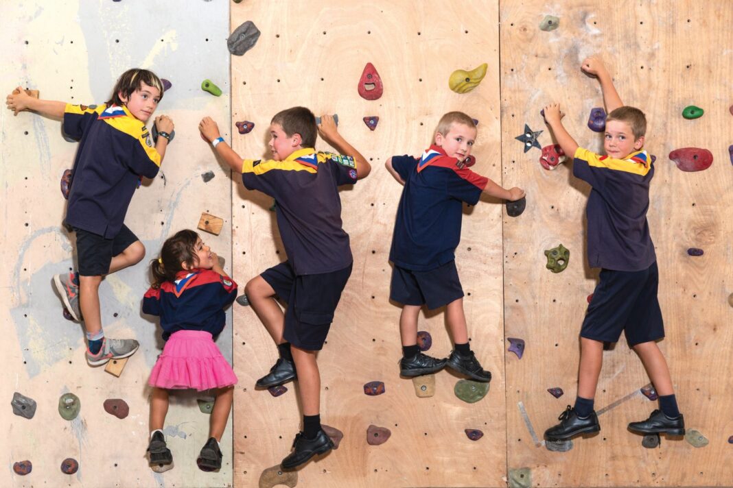 five kids rock climbing