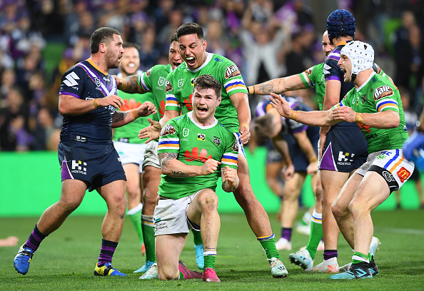 Canberra Raiders footballer celebrates after scoring a try against the Melbourne Storm.