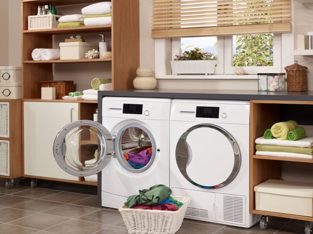 laundry room with washing machine open