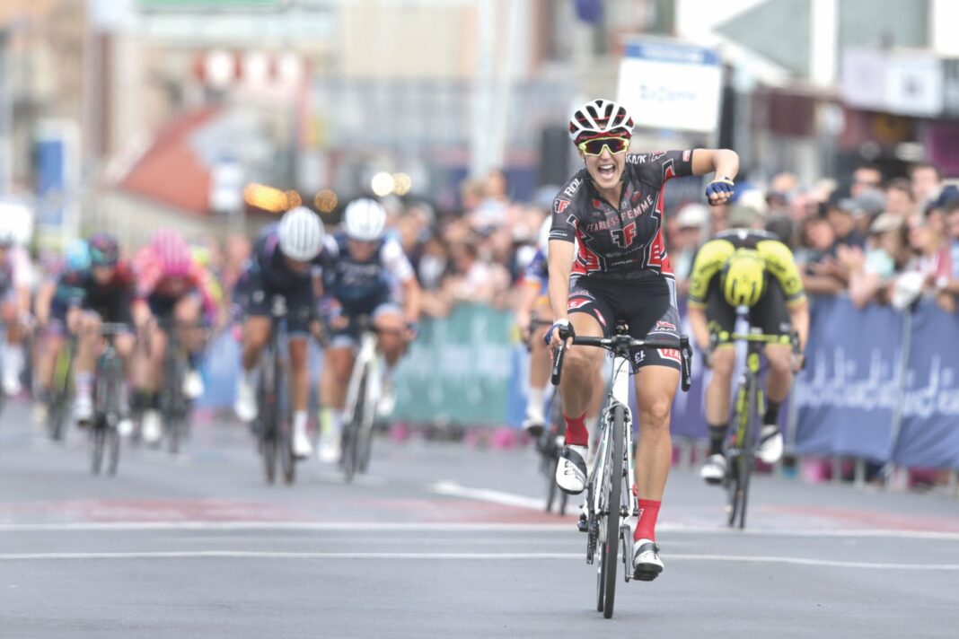 Rebecca Wiasak celebrates victory in the women’s criterium at the 2019 FedUni Road National Championships.
