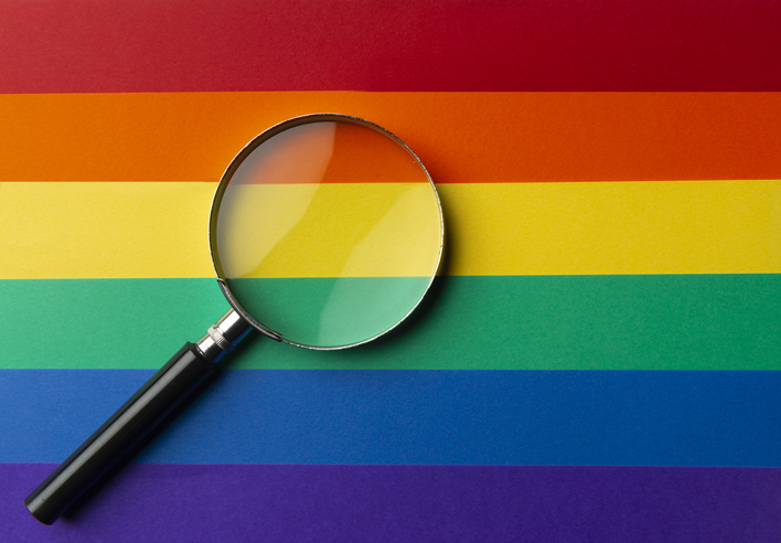 Magnifying glass on the lgbt background.