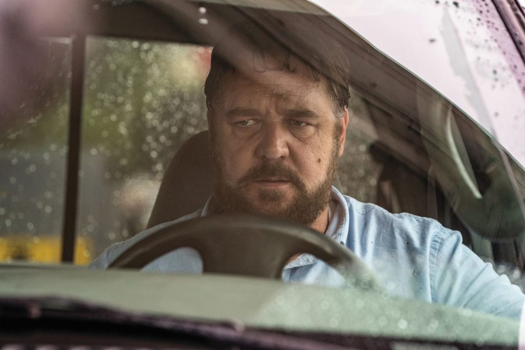 Russell Crowe sitting in a car in the movie unhinged