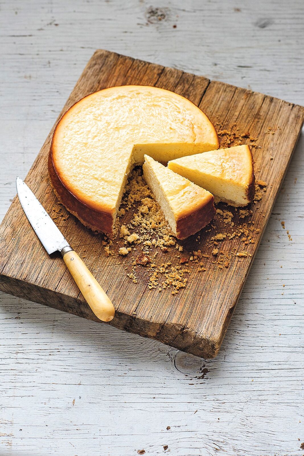 cheesecake on a wooden chopping board