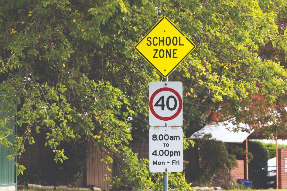 school bus road safety speed sign