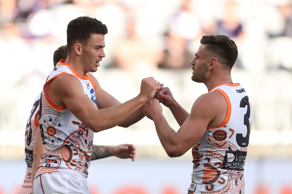 Jake Riccardi (left) celebrating one of his goals with Stephen Coniglio against the Fremantle Dockers