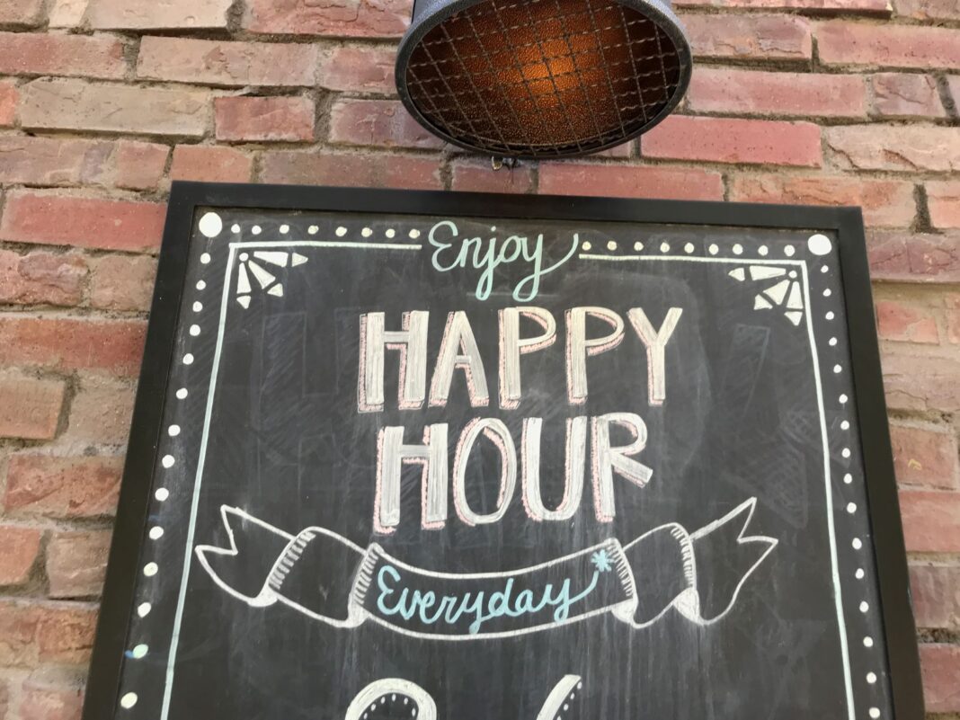 sign saying happy hour