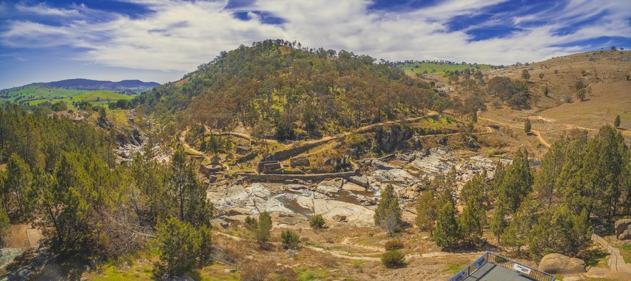 Adelong falls and gold mill ruins on bright sunny day
