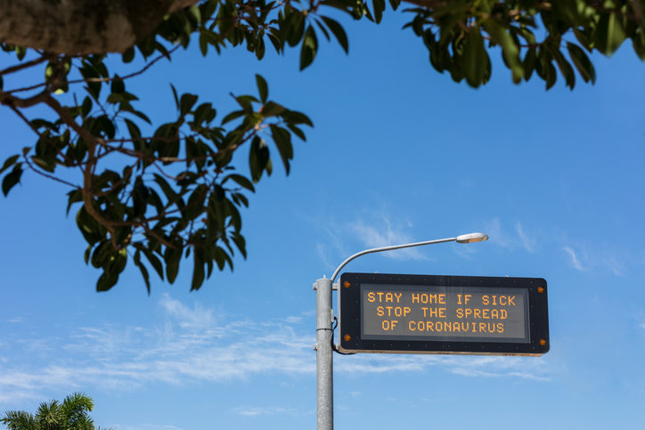 Highway sign telling people to stay home if unwell to stop the spread of coronavirus