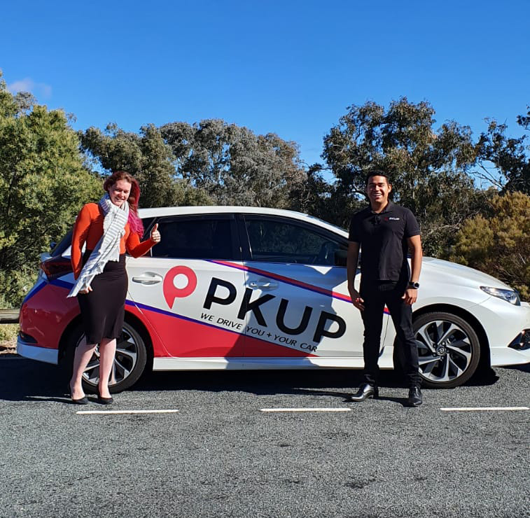 PKUP car with two people next to it