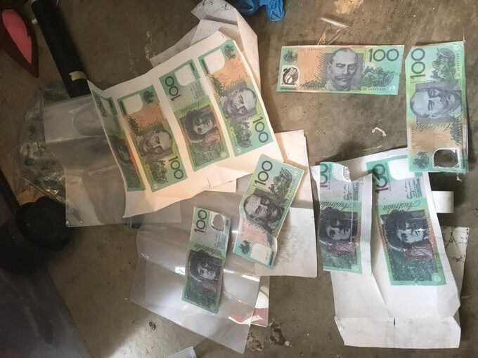 About one dozen counterfeit Australian $100 notes in envelopes or plastic zip-lock bags