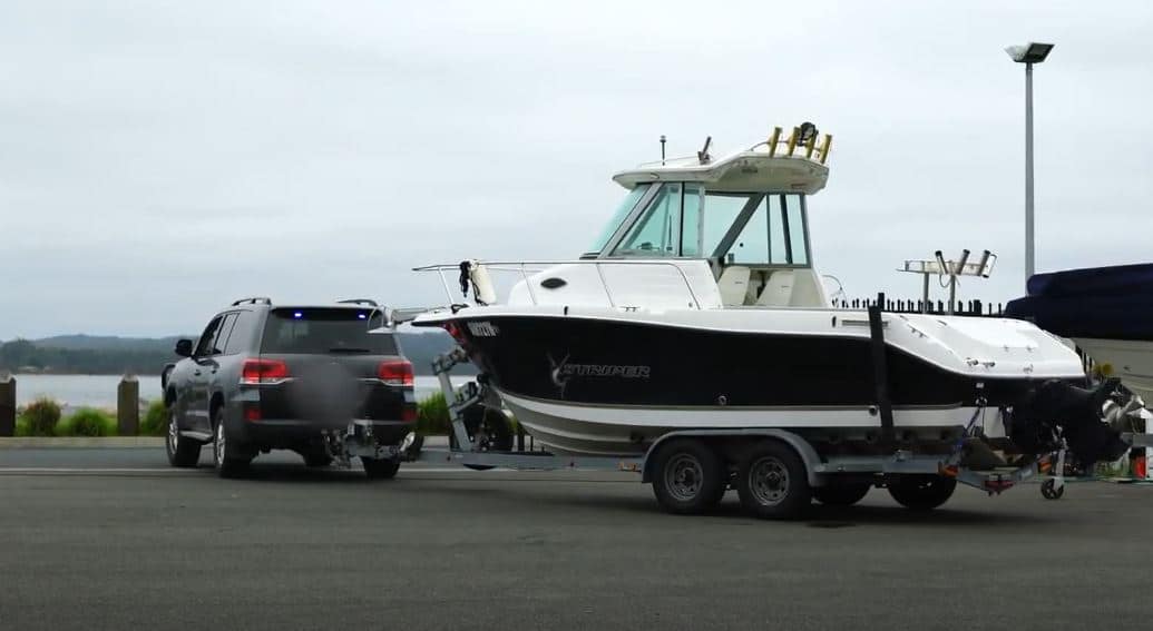 police car towing a boat