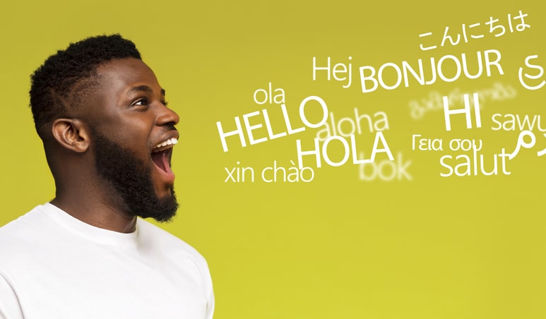 Young millennial afro man saying hello in many languages on yellow background