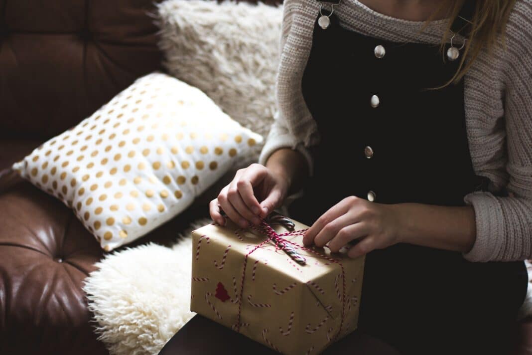 woman unwrapping a gift