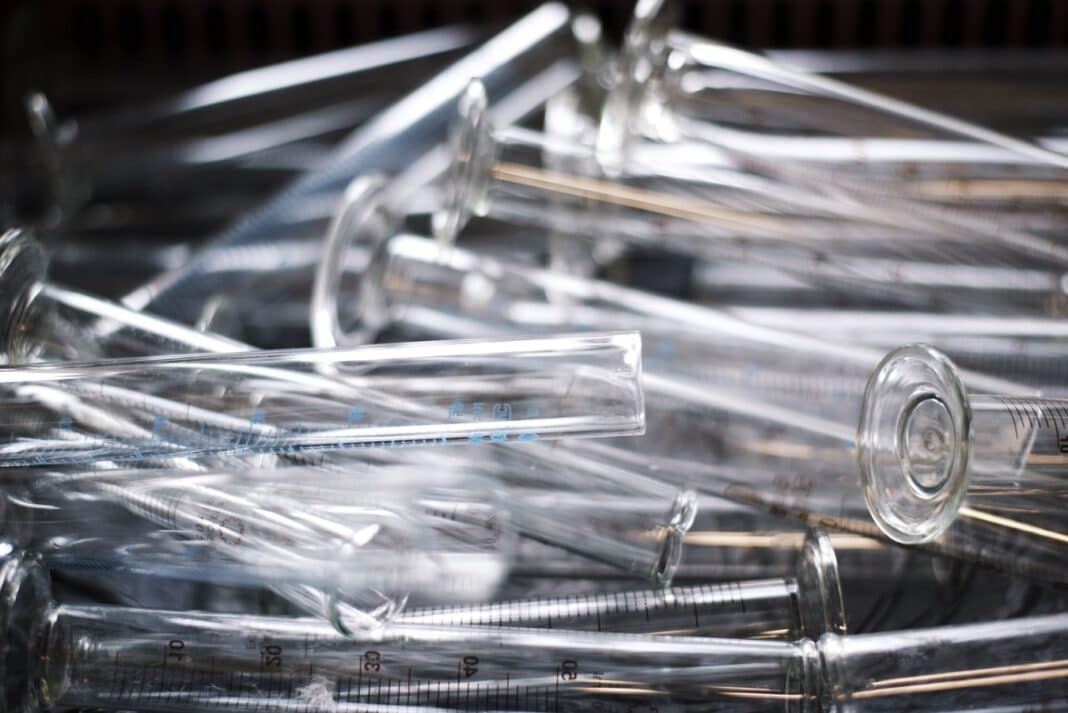 A stock image of medical test tubes signifies the research into sepsis