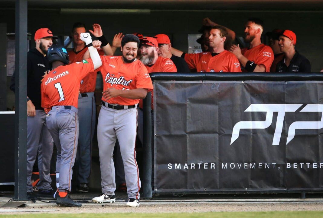 Canberra Cavalry celebrating in the dug out