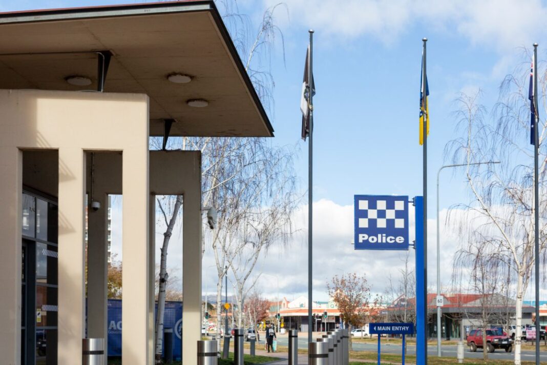 blue and white check police sign outside of police station in Canberra