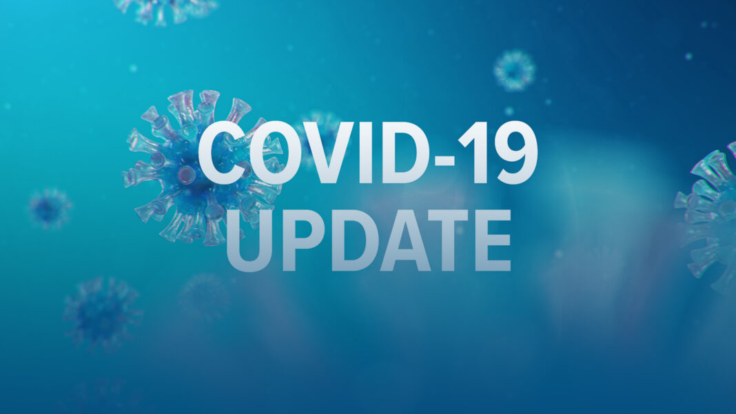 covid-19 update signage on blue background with graphics of coronavirus in blue