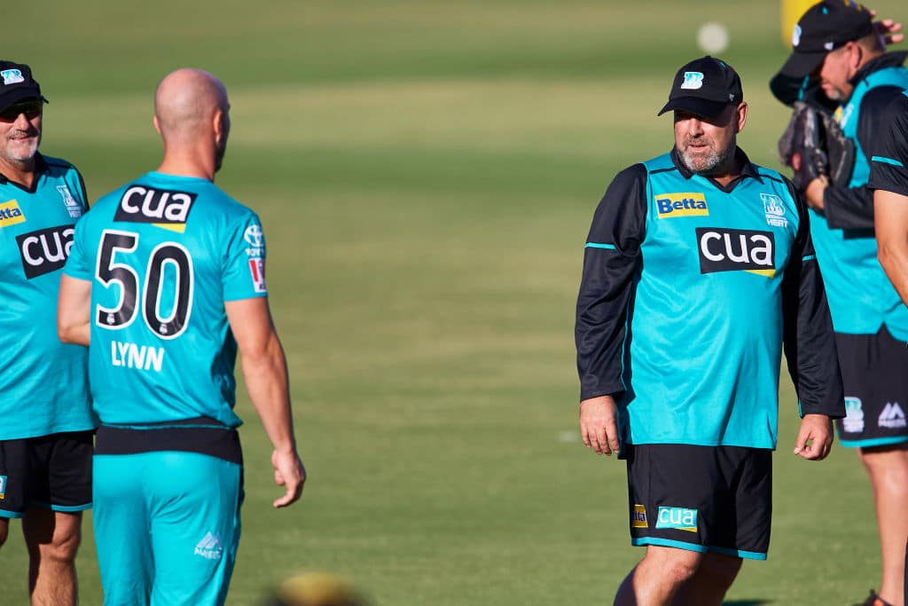 CANBERRA, AUSTRALIA - DECEMBER 14: Darren Lehmann, coach of the Head and Chris Lynn of the Heat speak during the Big Bash League match between the Sydney Thunder and the Brisbane Heat at Manuka Oval, on December 14, 2020, in Canberra, Australia. (Photo by Brett Hemmings - CA/Cricket Australia via Getty Images)