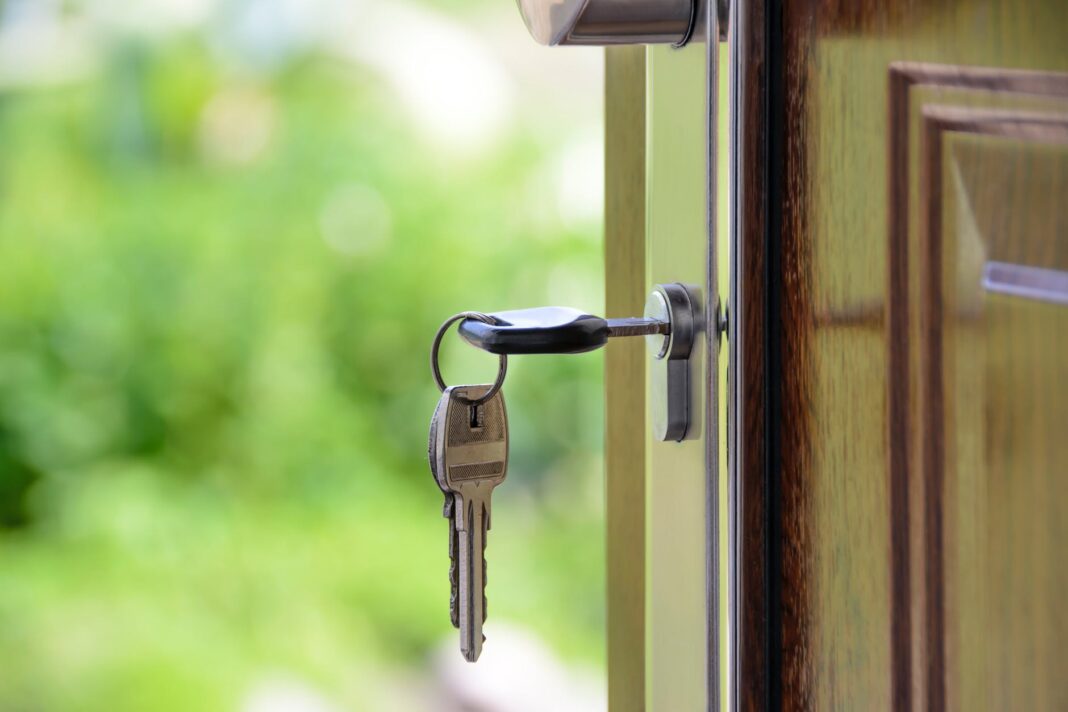 A photo of a key in the door to illustrate the story about the best investment suburbs in the ACT.