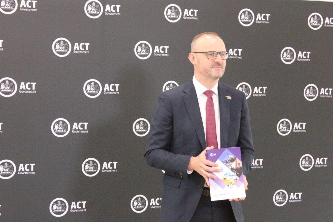 ACT Chief Minister Andrew Barr pictured with the ACT Budget papers for 2020-21.