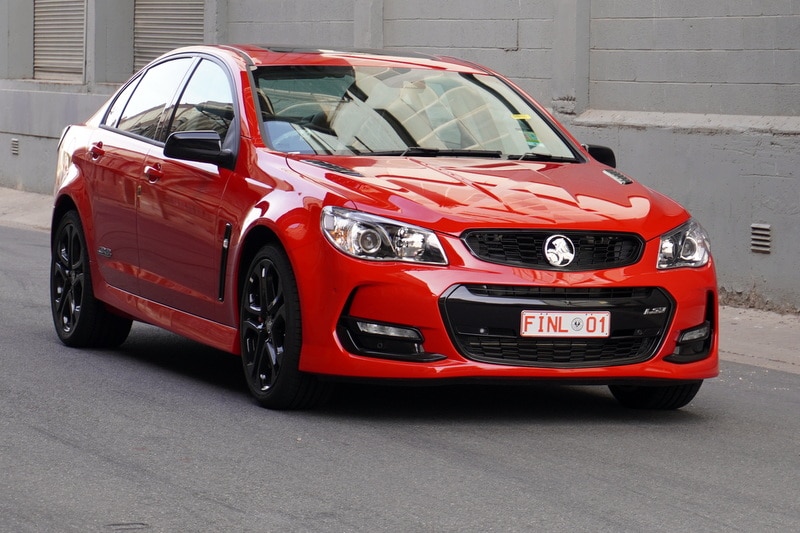 A red Holden Commodore, the last stamped in Australia. It sold for $750,000.