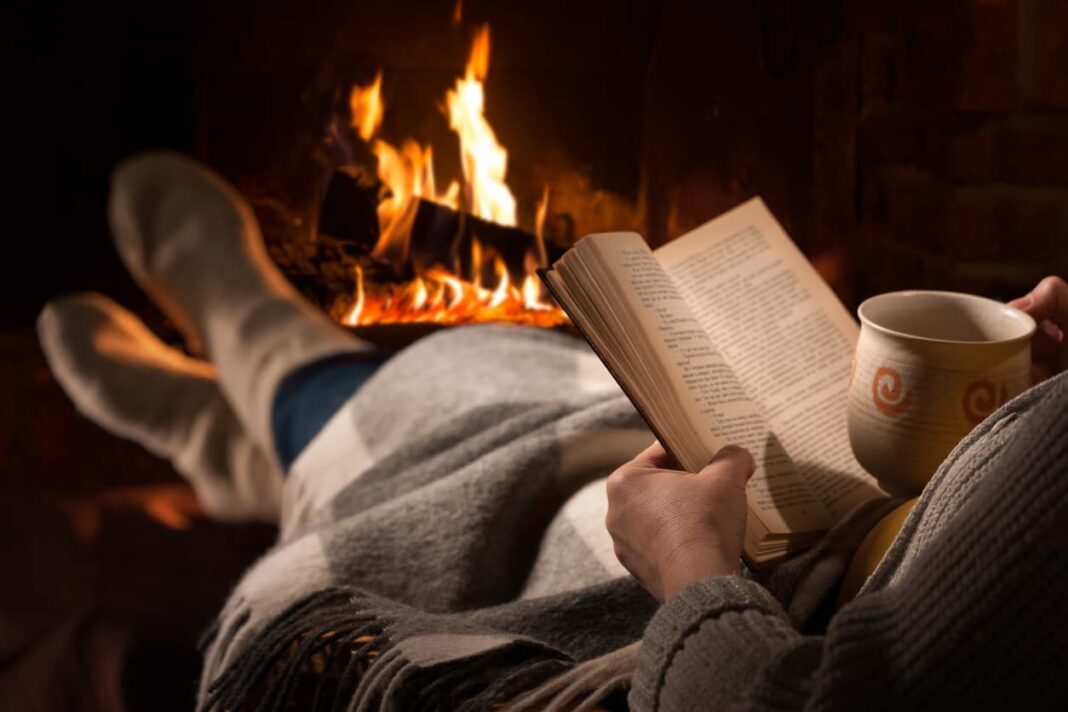 reading a book by the fire