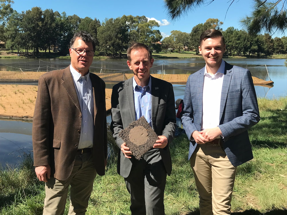 Dr Ralph Ogden (ACT Healthy Waterways), Shane Rattenbury MLA, Minister for Water, and Johnathan Davis MLA, Greens member for Bean, at the floating wetlands. Picture: Nick Fuller