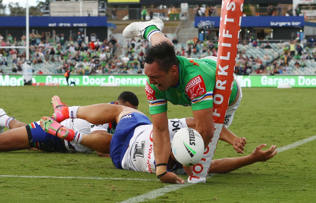CANBERRA, AUSTRALIA - MARCH 27: Roger Tuivasa-Sheck of the Warriors denies Jordan Rapana of the Raiders a try with a desperate diving tackle on full time during the round three NRL match between the Canberra Raiders and the Warriors at GIO Stadium on March 27, 2021, in Canberra, Australia. (Photo by Mark Nolan/Getty Images)