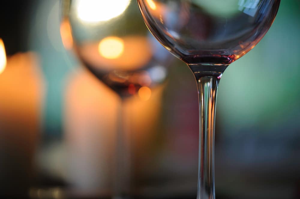 Risky alcohol use is considered to be more than two drinks a day - as symbolised by this photo of two empty wine glasses
