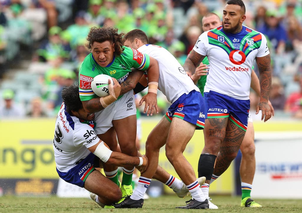 CANBERRA, AUSTRALIA - MARCH 27: Josh Papalii of the Raiders is tackled during the round three NRL match between the Canberra Raiders and the Warriors at GIO Stadium on March 27, 2021, in Canberra, Australia. (Photo by Mark Nolan/Getty Images)
