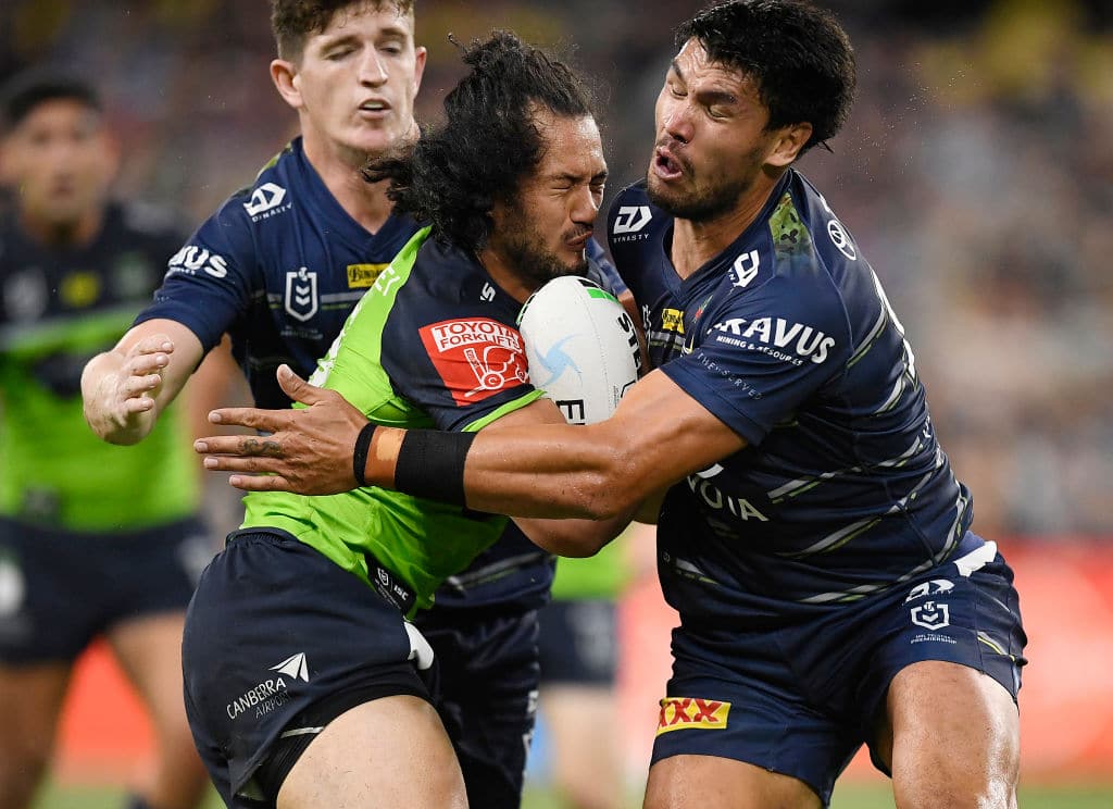 TOWNSVILLE, AUSTRALIA - APRIL 24: Corey Harawira-Naera of the Raiders is tackled by Jordan McLean of the Cowboys during the round seven NRL match between the North Queensland Cowboys and the Canberra Raiders at QCB Stadium, on April 24, 2021, in Townsville, Australia. (Photo by Ian Hitchcock/Getty Images)