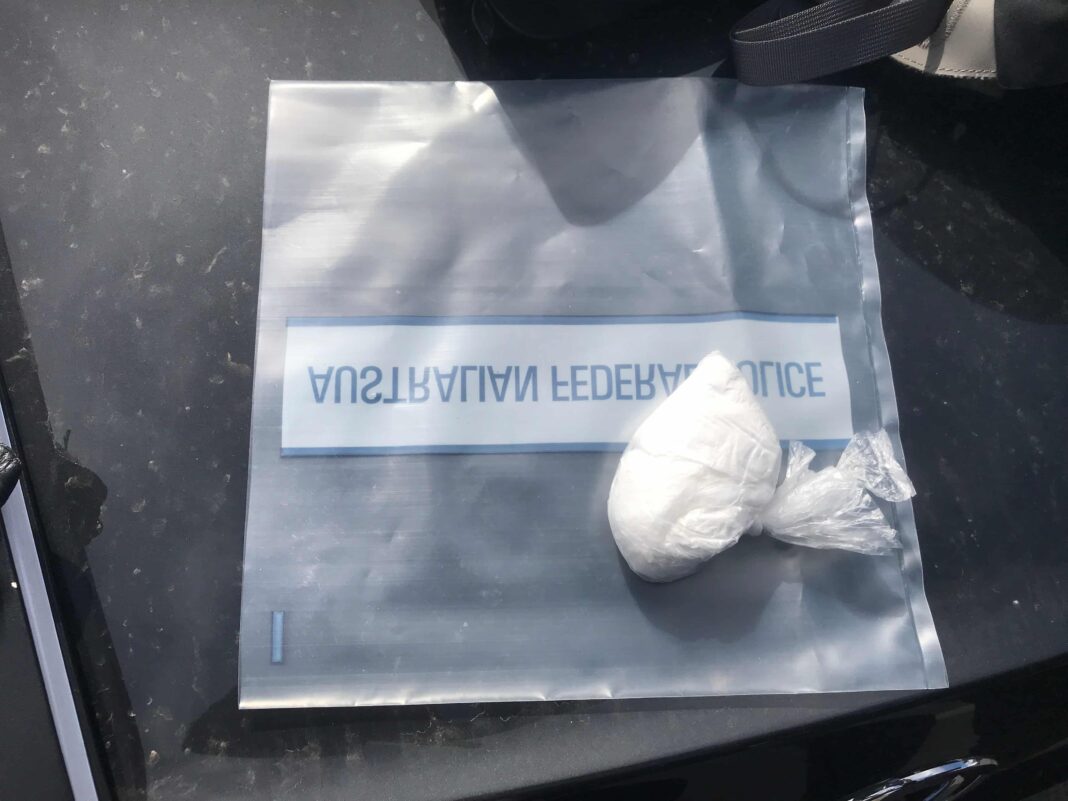 bag of white powder in a plastic police evidence bag