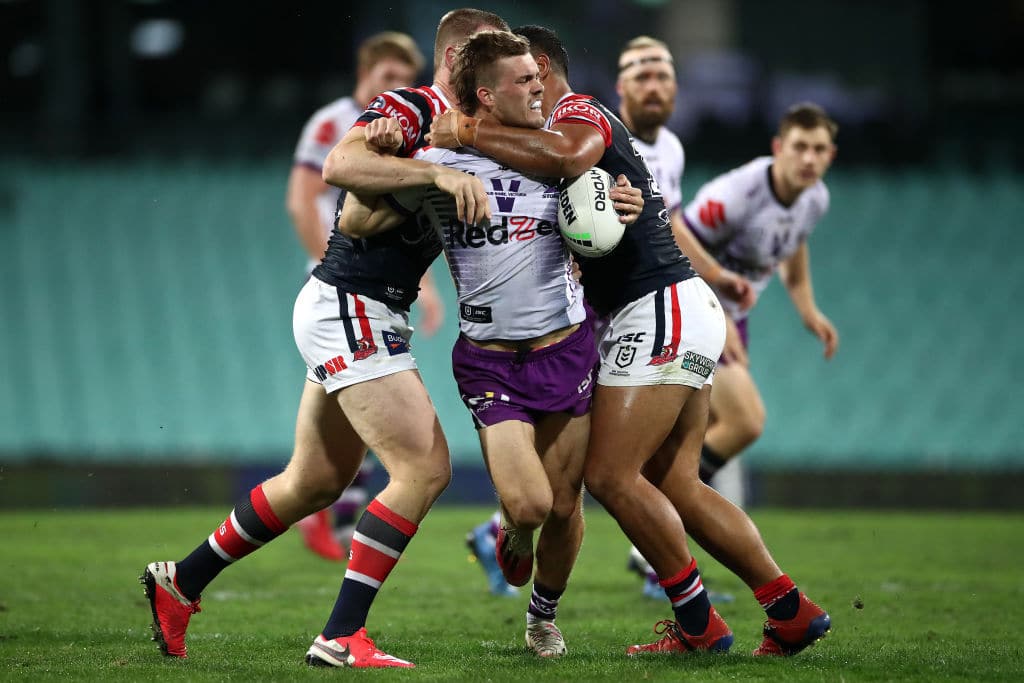 SYDNEY, AUSTRALIA - AUGUST 13: Ryan Papenhuyzen of the Storm is tackled during the round 14 NRL match between the Sydney Roosters and the Melbourne Storm at the Sydney Cricket Ground on August 13, 2020 in Sydney, Australia. (Photo by Cameron Spencer/Getty Images)