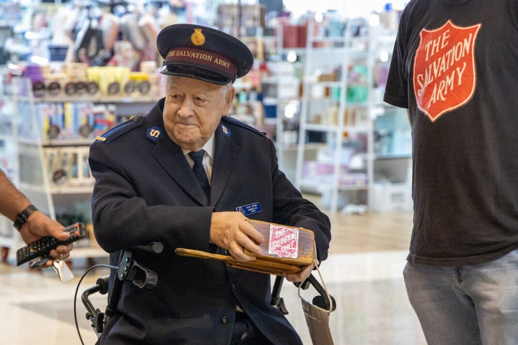 elderly Salvation Army man seeking donations at Canberra Centre shopping mall
