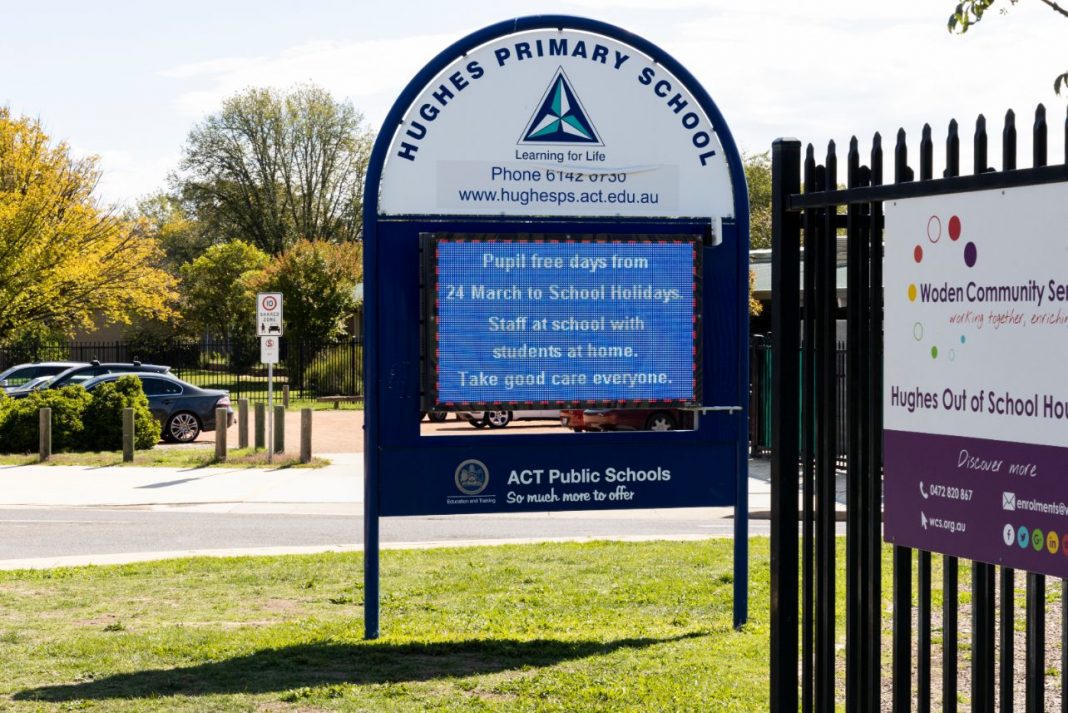 electronic sign board on grassy lawns outside Hughes Primary School in Canberra