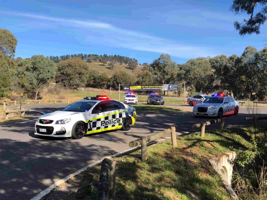 several police cars parked at roadside rest stop beside the highway between Canberra and Bungendore