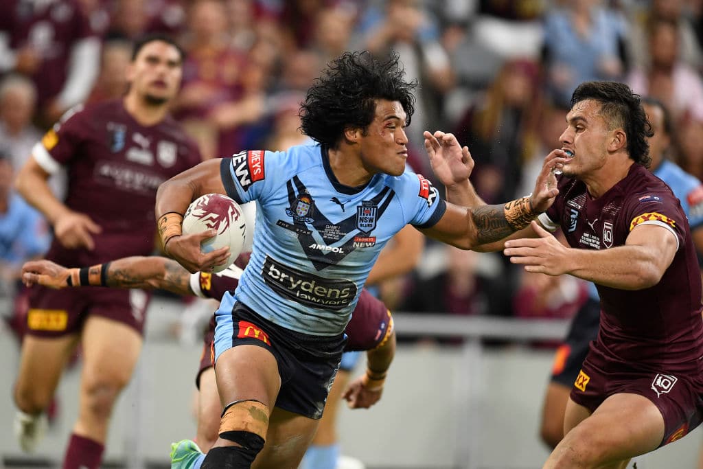 TOWNSVILLE, AUSTRALIA - JUNE 09: Brian To'o of the Blues is tackled during game one of the 2021 State of Origin series between the New South Wales Blues and the Queensland Maroons at Queensland Country Bank Stadium on June 09, 2021 in Townsville, Australia. (Photo by Ian Hitchcock/Getty Images)