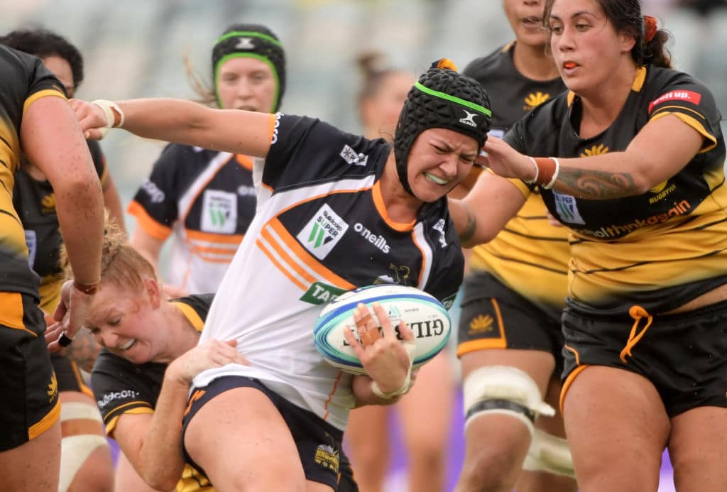 CANBERRA, AUSTRALIA - FEBRUARY 15: Michaela Leonard of the Brumbies is tackled during the Brumbies and Rugby WA round 1 match at GIO Stadium on February 15, 2020 in Canberra, Australia. (Photo by Tracey Nearmy/Getty Images)