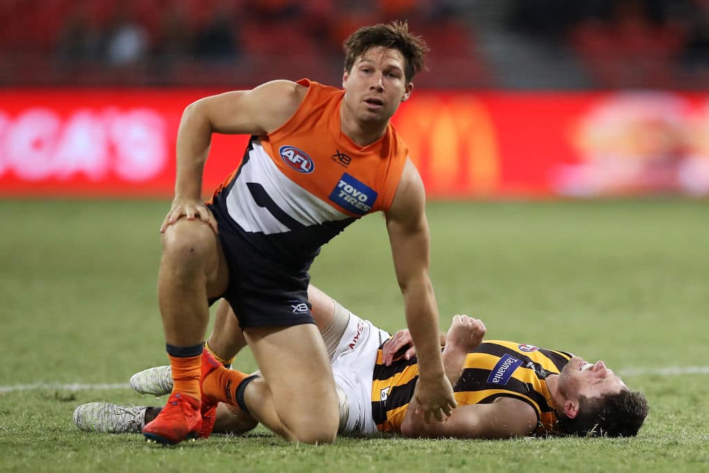 SYDNEY, AUSTRALIA - JULY 05: Liam Shiels of the Hawks lies injured on the ground after he was tackled by Toby Greene of the Giants during the round 5 AFL match between the Greater Western Sydney Giants and the Hawthorn Hawks at GIANTS Stadium on July 05, 2020 in Sydney, Australia. (Photo by Mark Kolbe/Getty Images)