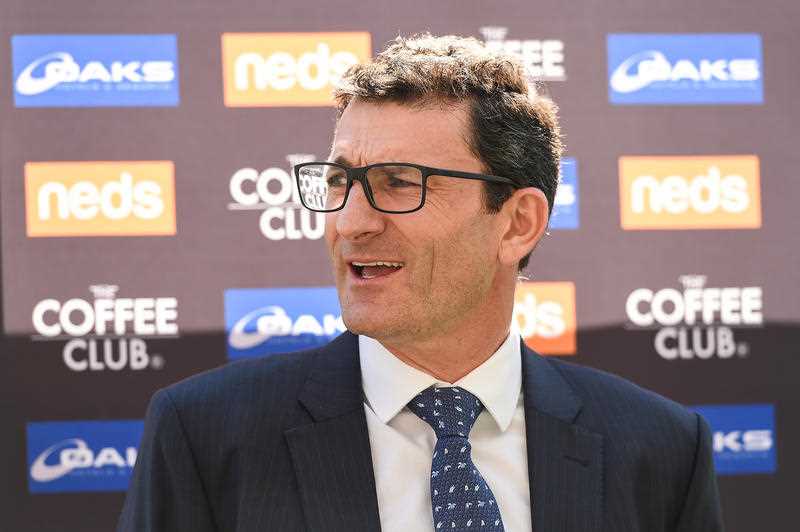 AFL General Manager of Clubs and Broadcasting Travis Auld makes an announcement during a Brisbane Lions announcement at the Gabba in Brisbane