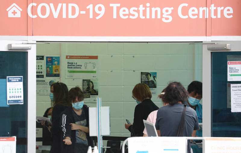 People line up to be tested at the Gold Coast University Hospital COVID-19 testing centre