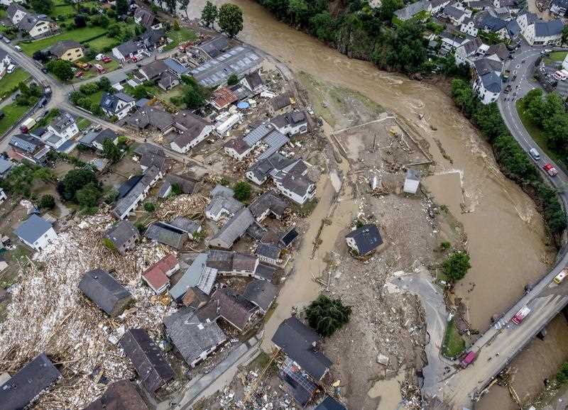 Destroyed houses are seen close to the flooded Ahr river in Schuld, Germany